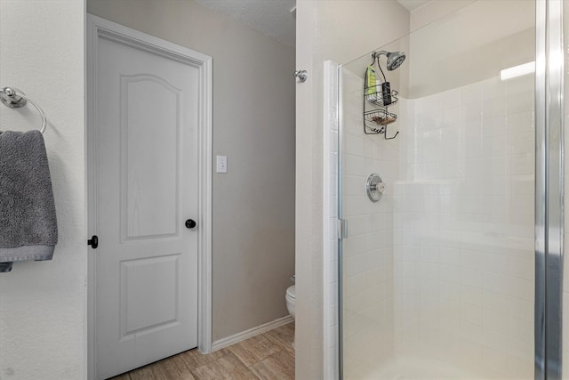 1036 Ridgetop Dr, Justin, TX 76247 - full bathroom with a shower stall, toilet, wood finished floors, and baseboards