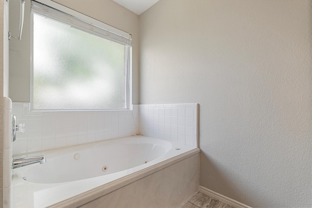 1036 Ridgetop Dr, Justin, TX 76247 - full bathroom with a jetted tub and a textured wall