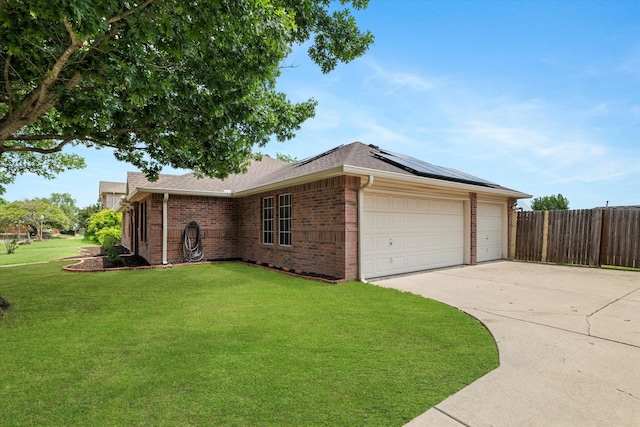 1036 Ridgetop Dr, Justin, TX 76247 - view of front of home with solar panels, brick siding, a shingled roof, a garage, and driveway