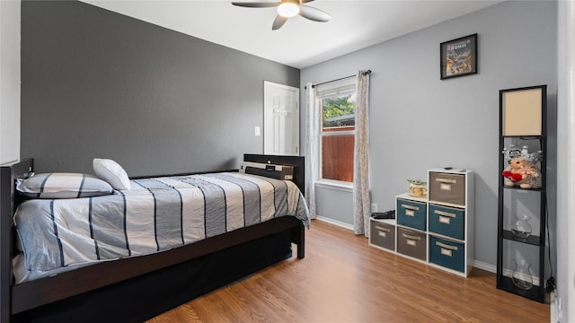 5323 Northridge Blvd, North Richland Hills, TX 76180 - bedroom with wood finished floors, baseboards, and a ceiling fan