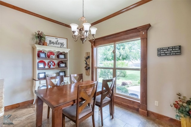 602 Prosperity Rd, Abilene, TX 79602 - dining area featuring a chandelier, ornamental molding, healthy amount of natural light, and baseboards