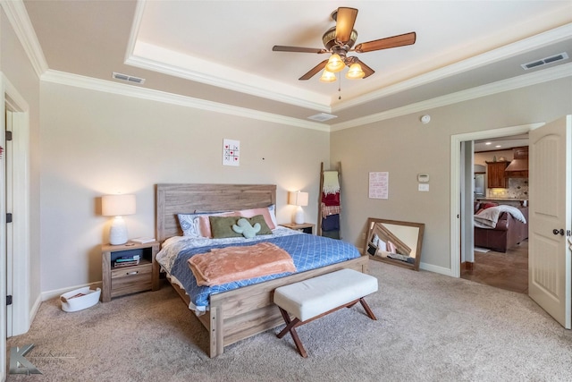 602 Prosperity Rd, Abilene, TX 79602 - carpeted bedroom with a tray ceiling, crown molding, a ceiling fan, and baseboards