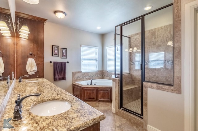 602 Prosperity Rd, Abilene, TX 79602 - full bath with a shower stall, a bath, double vanity, tile patterned floors, and a chandelier