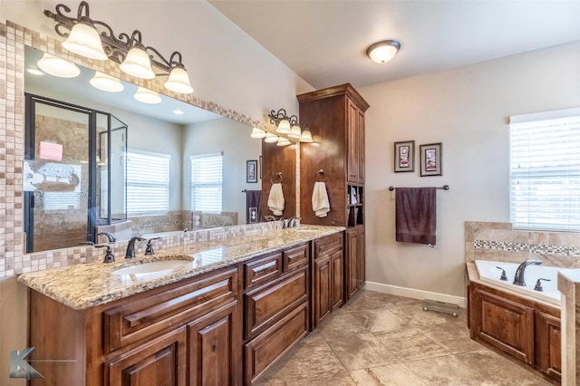 602 Prosperity Rd, Abilene, TX 79602 - full bath with a garden tub, double vanity, a stall shower, and baseboards