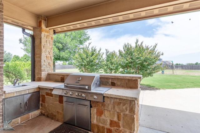 602 Prosperity Rd, Abilene, TX 79602 - view of patio / terrace featuring a sink, exterior kitchen, and a playground