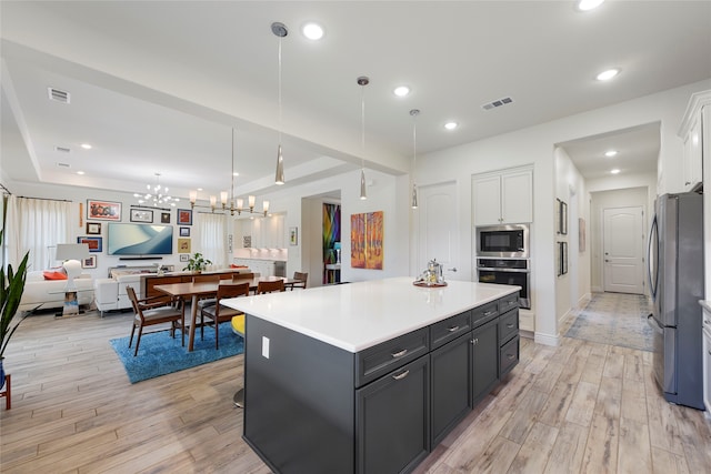 11017 Cartwright Dr, Denton, TX 76207 - kitchen featuring stainless steel appliances, light wood-style floors, white cabinets, light countertops, and recessed lighting