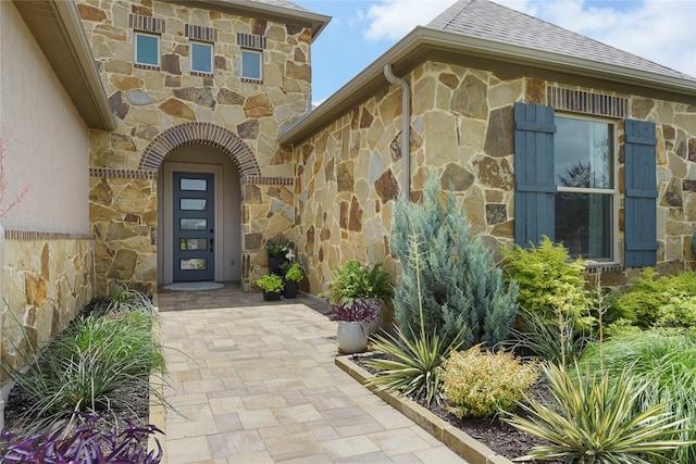 11017 Cartwright Dr, Denton, TX 76207 - doorway to property with stone siding and roof with shingles