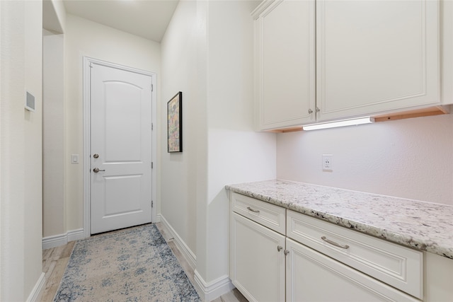 11017 Cartwright Dr, Denton, TX 76207 - entryway with baseboards and light wood finished floors