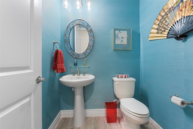 11017 Cartwright Dr, Denton, TX 76207 - half bathroom with baseboards, toilet, and wood finished floors