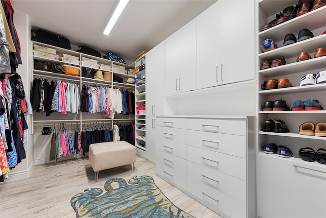 11017 Cartwright Dr, Denton, TX 76207 - walk in closet with wood finished floors