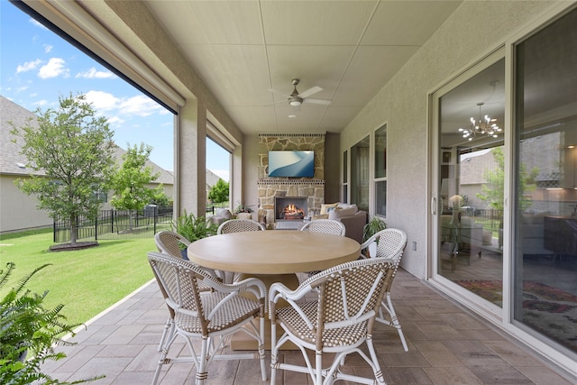 11017 Cartwright Dr, Denton, TX 76207 - view of patio featuring an outdoor stone fireplace, a ceiling fan, and outdoor dining area