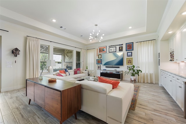 11017 Cartwright Dr, Denton, TX 76207 - living area with a tray ceiling, a chandelier, light wood-style flooring, baseboards, and recessed lighting
