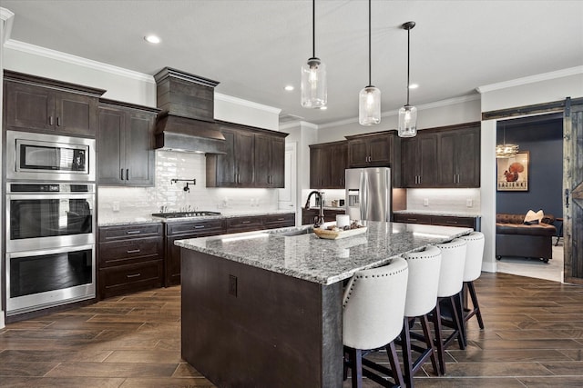 1007 Sinopa St, Caddo Mills, TX 75135 - kitchen with appliances with stainless steel finishes, a sink, recessed lighting, crown molding, and tasteful backsplash