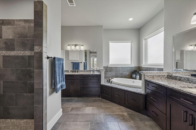 1007 Sinopa St, Caddo Mills, TX 75135 - full bathroom with a bath, two vanities, and walk in shower