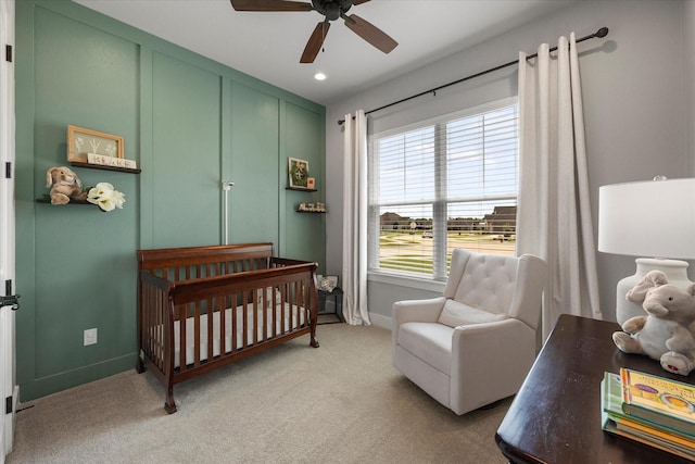 1007 Sinopa St, Caddo Mills, TX 75135 - bedroom featuring a crib, light carpet, baseboards, ceiling fan, and recessed lighting