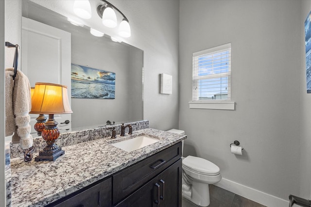 1007 Sinopa St, Caddo Mills, TX 75135 - bathroom featuring baseboards, toilet, vanity, and tile patterned floors
