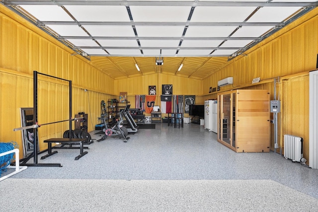 1007 Sinopa St, Caddo Mills, TX 75135 - garage featuring radiator, water heater, and a wall mounted air conditioner