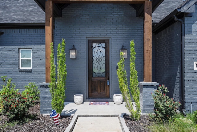 1007 Sinopa St, Caddo Mills, TX 75135 - doorway to property with brick siding and a shingled roof
