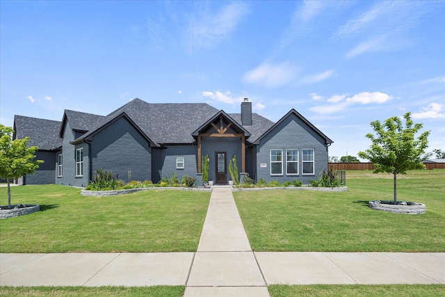 1007 Sinopa St, Caddo Mills, TX 75135 - view of front of house featuring a chimney, roof with shingles, and brick siding