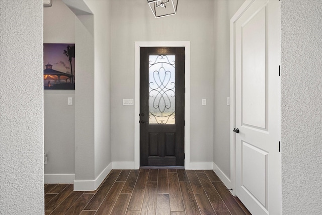 1007 Sinopa St, Caddo Mills, TX 75135 - foyer featuring dark wood-type flooring, baseboards, and a textured wall