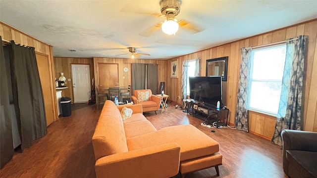 5632 Taylor Rd, River Oaks, TX 76114 - living area featuring plenty of natural light, wood finished floors, wood walls, and a ceiling fan