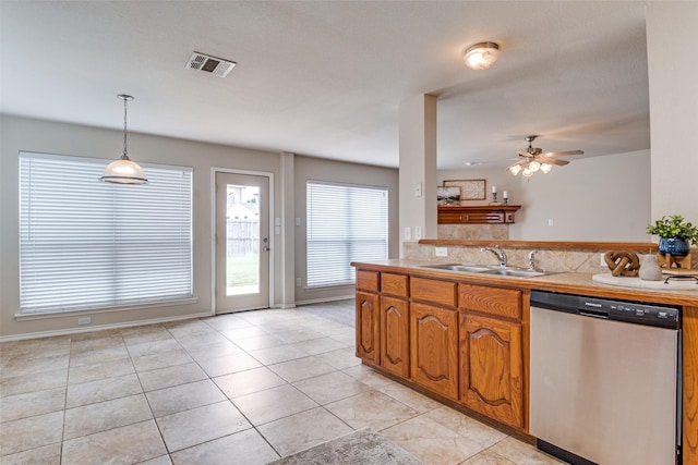 2600 Spencer Cir, Royse City, TX 75189 - kitchen with dishwasher, a sink, brown cabinetry, ceiling fan, and light countertops