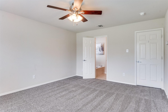 2600 Spencer Cir, Royse City, TX 75189 - unfurnished bedroom with carpet flooring, baseboards, a ceiling fan, and ensuite bathroom