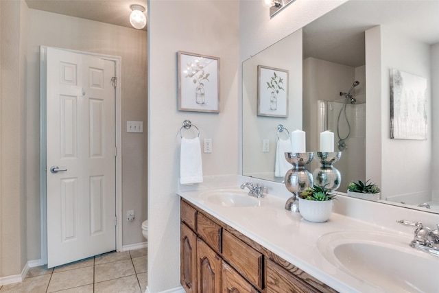 2600 Spencer Cir, Royse City, TX 75189 - full bath with toilet, double vanity, tile patterned floors, a shower, and baseboards