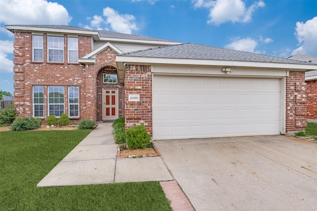 2600 Spencer Cir, Royse City, TX 75189 - traditional home with brick siding, concrete driveway, an attached garage, a front lawn, and a shingled roof