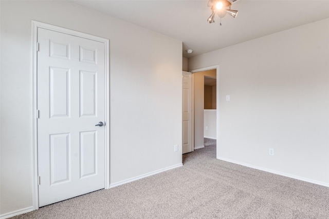 2600 Spencer Cir, Royse City, TX 75189 - unfurnished bedroom with carpet floors, baseboards, and a ceiling fan