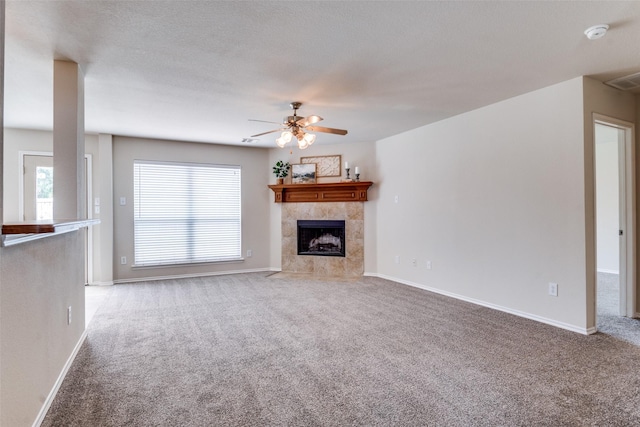 2600 Spencer Cir, Royse City, TX 75189 - unfurnished living room with carpet, a ceiling fan, a fireplace, and baseboards
