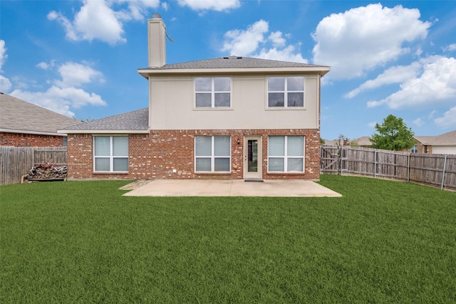 2600 Spencer Cir, Royse City, TX 75189 - back of property featuring a patio area, a chimney, brick siding, and roof with shingles