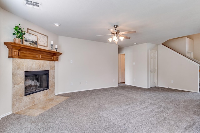 2600 Spencer Cir, Royse City, TX 75189 - unfurnished living room featuring a ceiling fan, carpet, a tiled fireplace, and baseboards