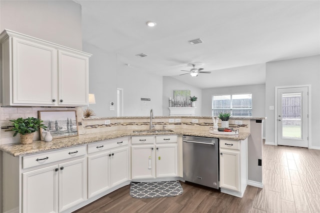 2814 Saddlebred Trl, Celina, TX 75009 - kitchen with dishwasher, a sink, a ceiling fan, a peninsula, and backsplash