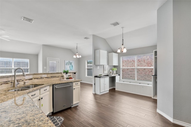 2814 Saddlebred Trl, Celina, TX 75009 - kitchen with stainless steel dishwasher, a chandelier, a sink, white cabinetry, and lofted ceiling