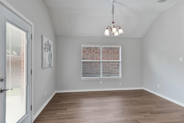 2814 Saddlebred Trl, Celina, TX 75009 - empty room with vaulted ceiling, a chandelier, wood finished floors, and baseboards