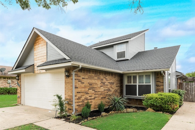 2537 Montclair Ln, Mesquite, TX 75150 - view of front of property featuring a shingled roof, concrete driveway, brick siding, and a garage