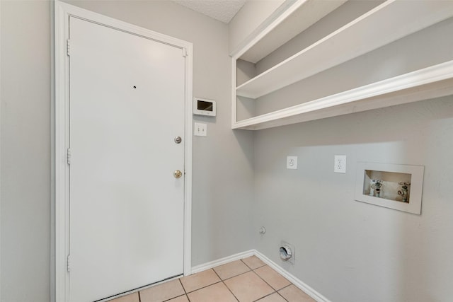 2537 Montclair Ln, Mesquite, TX 75150 - washroom with hookup for an electric dryer, hookup for a washing machine, light tile patterned floors, baseboards, and gas dryer hookup