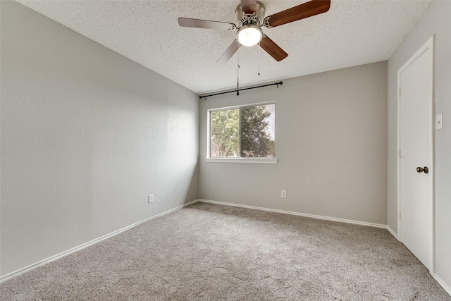 2537 Montclair Ln, Mesquite, TX 75150 - carpeted spare room featuring a textured ceiling, ceiling fan, and baseboards