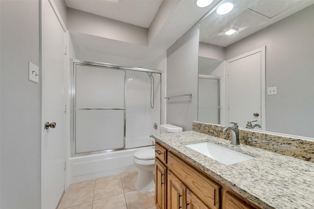 2537 Montclair Ln, Mesquite, TX 75150 - full bathroom featuring toilet, vanity, shower / bath combination with glass door, and tile patterned flooring