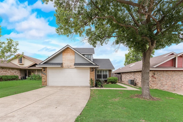 2537 Montclair Ln, Mesquite, TX 75150 - mid-century modern home featuring brick siding, central AC, a garage, a front lawn, and concrete driveway