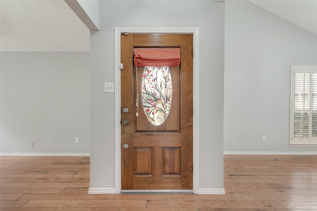 2537 Montclair Ln, Mesquite, TX 75150 - foyer featuring hardwood / wood-style floors, baseboards, and vaulted ceiling