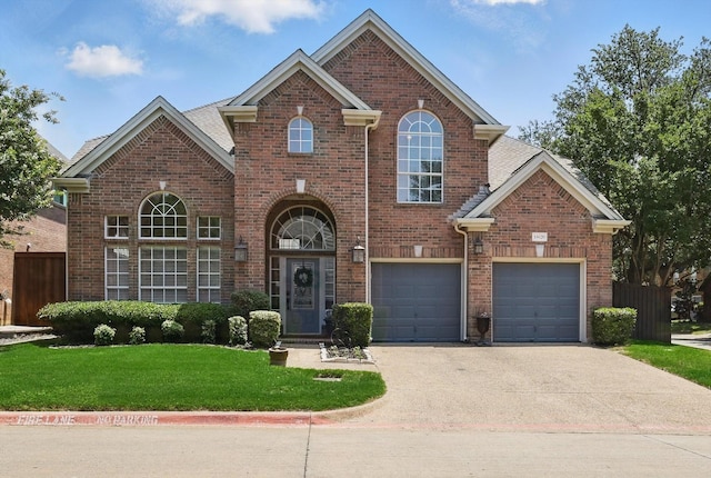 14620 Windsor Ct, Addison, TX 75001 - view of front of house featuring brick siding, asphalt driveway, and a garage
