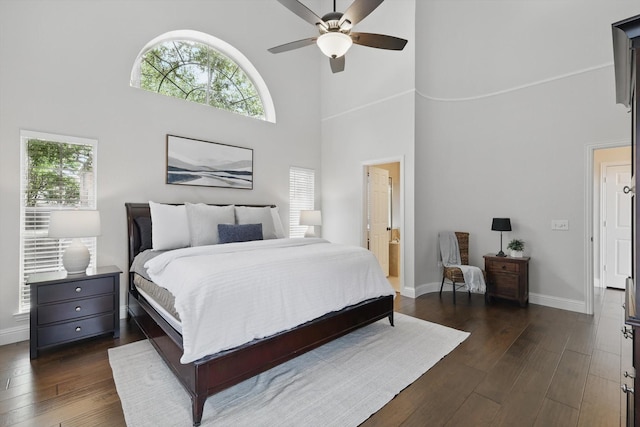 14620 Windsor Ct, Addison, TX 75001 - bedroom featuring multiple windows, a high ceiling, dark wood finished floors, and baseboards