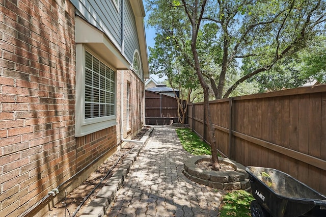 14620 Windsor Ct, Addison, TX 75001 - fenced backyard featuring a patio area
