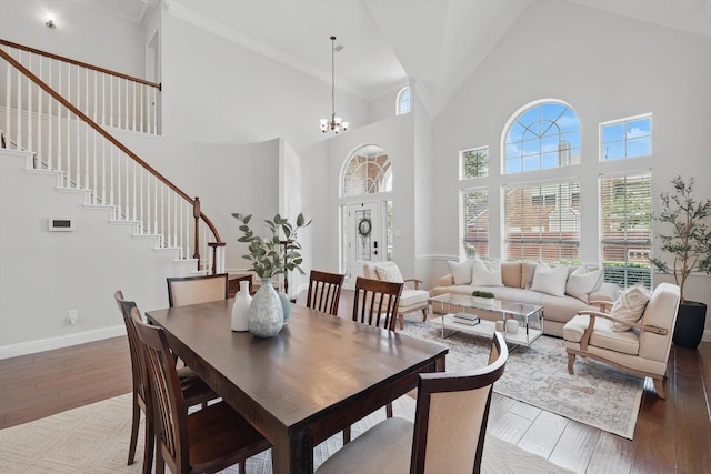 14620 Windsor Ct, Addison, TX 75001 - dining space with hardwood / wood-style flooring, high vaulted ceiling, stairs, baseboards, and a chandelier