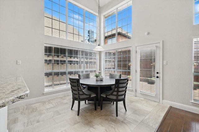 14620 Windsor Ct, Addison, TX 75001 - dining area with a high ceiling and baseboards