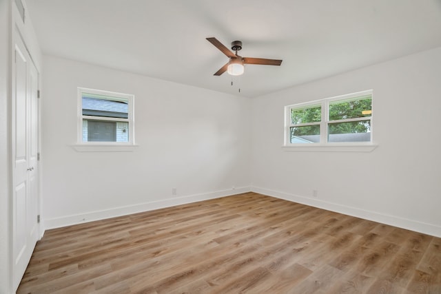436 Crestwood Ter, Hurst, TX 76053 - unfurnished bedroom with baseboards, light wood-style flooring, and a ceiling fan
