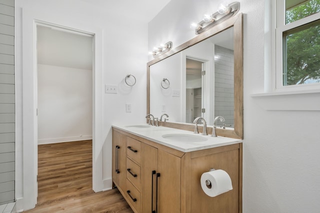 436 Crestwood Ter, Hurst, TX 76053 - full bathroom with double vanity, wood finished floors, and baseboards