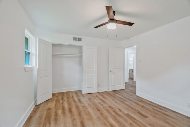 436 Crestwood Ter, Hurst, TX 76053 - unfurnished bedroom featuring light wood-type flooring, a closet, baseboards, and a ceiling fan